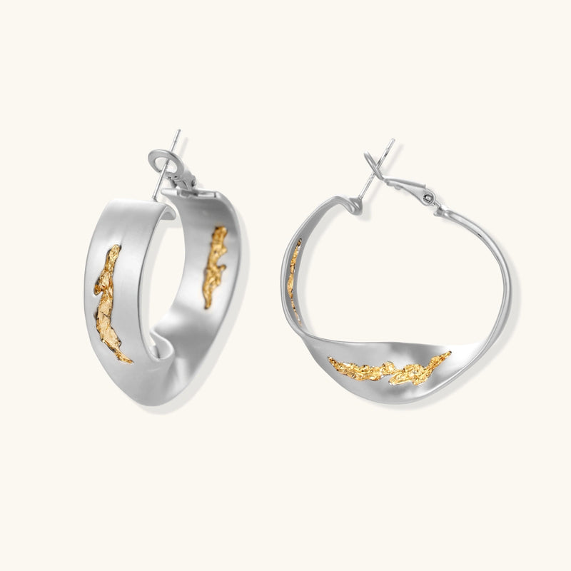 Silver hoop earrings with organic gold flowing accents, featuring eco-zinc alloy construction and secure posts.