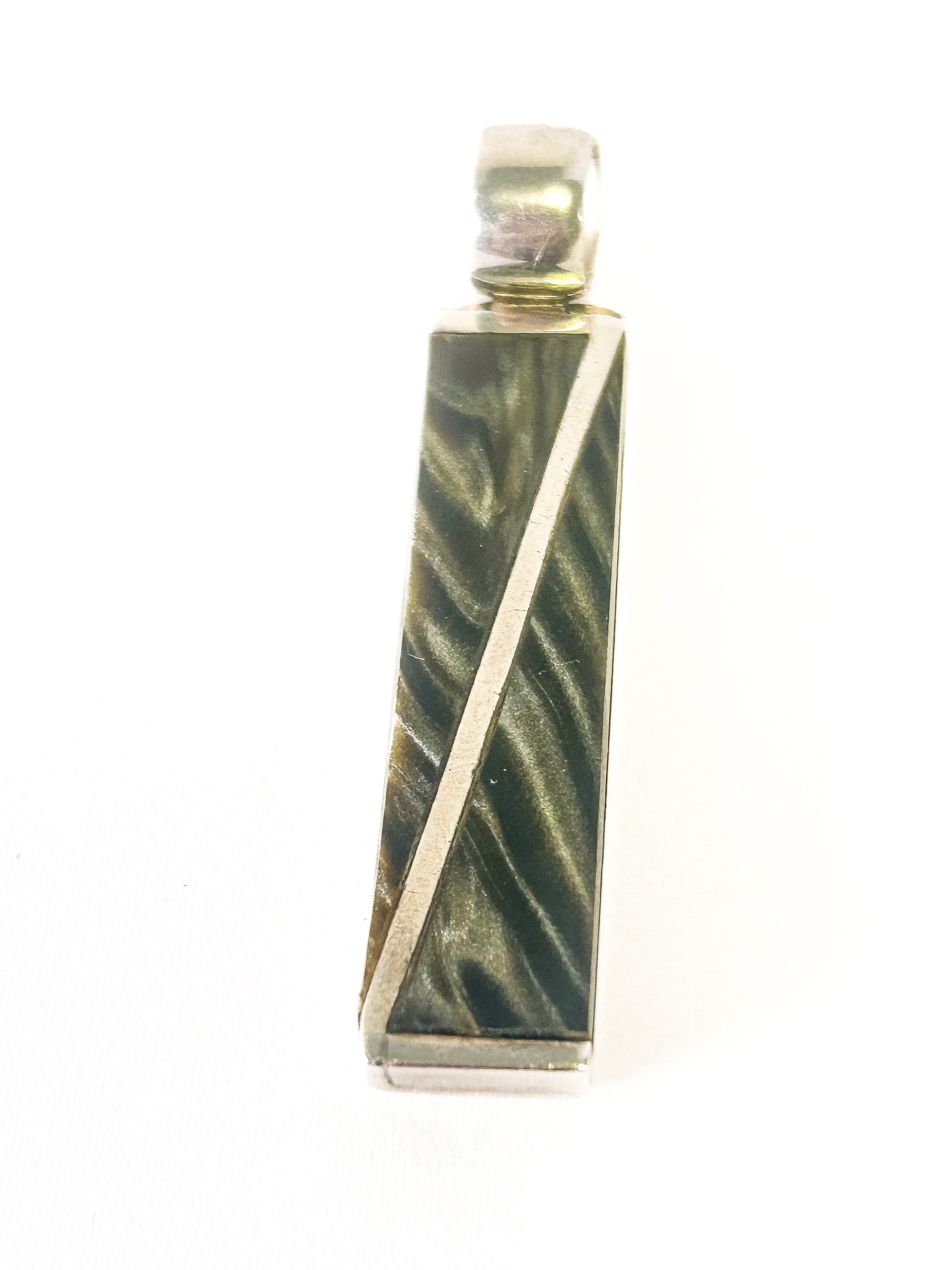 Marbled green and gold pendant on a white background